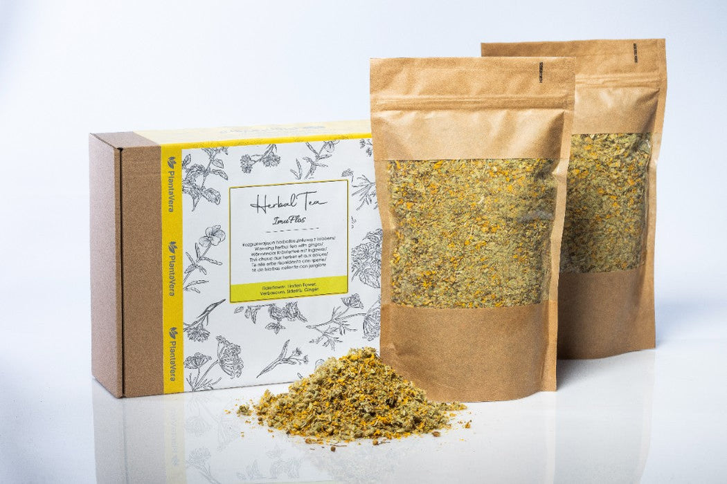 Coffret de thé Herbal Tea Immuflos sur fond noir pour une expérience de dégustation élégante.