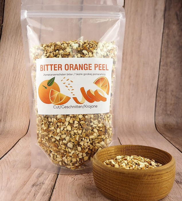 Sachet transparent de pelures d'orange amère séchées coupées, parfait pour aromatiser les infusions.